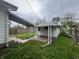 The property features a carport, storage shed and backyard bordered by a wooden fence at 1622 S Randolph St, Indianapolis, IN 46203