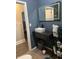 A stylish bathroom boasts a floating sink with striking backsplash and modern finishes at 1622 S Randolph St, Indianapolis, IN 46203