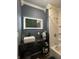 A contemporary bathroom features a decorative lighted mirror, marble countertop, and updated shower at 1622 S Randolph St, Indianapolis, IN 46203