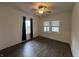 Spacious bedroom features natural light, wood floors, and a ceiling fan at 1622 S Randolph St, Indianapolis, IN 46203