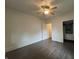 Bedroom with wood floors and ceiling fan, leading to a closet and bathroom at 1622 S Randolph St, Indianapolis, IN 46203