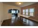 Dining area with an elegant table, complemented by wood floors and view to an adjacent living space at 1622 S Randolph St, Indianapolis, IN 46203