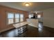 Bright dining area with wood floors and adjacent kitchen, offering a seamless flow for modern living at 1622 S Randolph St, Indianapolis, IN 46203