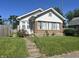 Inviting single-Gathering home with a brick foundation and a well-maintained front lawn at 1622 S Randolph St, Indianapolis, IN 46203