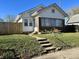 Charming home with a small front yard and inviting concrete steps leading to the entrance at 1622 S Randolph St, Indianapolis, IN 46203