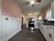 Bright and airy kitchen with updated appliances and a seamless transition to the adjacent dining and living spaces at 1622 S Randolph St, Indianapolis, IN 46203