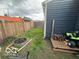 Side yard features a fire pit and additional storage space at 1623 Oliver Ave, Indianapolis, IN 46221