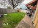 Lush backyard features a play area and a brick patio at 1623 Oliver Ave, Indianapolis, IN 46221