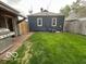 Backyard featuring a grill, grassy area, and a brick patio at 1623 Oliver Ave, Indianapolis, IN 46221