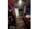 Bedroom with fan, tv, wood plank flooring and custom shelving at 1623 Oliver Ave, Indianapolis, IN 46221