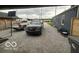Long gravel driveway provides plenty of parking in front of detached garage at 1623 Oliver Ave, Indianapolis, IN 46221