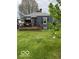 Charming home featuring a cozy front porch and well-manicured lawn at 1623 Oliver Ave, Indianapolis, IN 46221