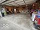 Large garage with built-in shelves and storage, perfect for organization and hobbies at 1623 Oliver Ave, Indianapolis, IN 46221