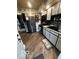 Well-lit kitchen with stainless steel appliances and stylish backsplash at 1623 Oliver Ave, Indianapolis, IN 46221