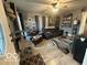 Cozy living room featuring neutral color scheme, carpet, and natural light at 1623 Oliver Ave, Indianapolis, IN 46221