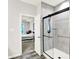 Shower featuring sleek black frame and access to bedroom showing the bed and decor at 16693 Churning Way, Noblesville, IN 46060