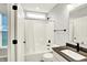 Bathroom with modern sink and fixtures, white shower curtain, and view to exterior at 16693 Churning Way, Noblesville, IN 46060