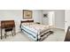 Cozy bedroom with light gray walls featuring a floral patterned quilt and decorative accents throughout at 16693 Churning Way, Noblesville, IN 46060