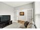 Comfortable living space with a TV and open view to a separate room at 16693 Churning Way, Noblesville, IN 46060