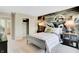 Stylish bedroom featuring a sports theme mural, open closet, and contemporary furnishings at 1713 Hemlock Cir, Greenfield, IN 46140