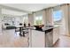 Open kitchen with island seating flows into the dining and living spaces, perfect for entertaining at 1713 Hemlock Cir, Greenfield, IN 46140