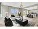Open-concept living space with view into kitchen and dining areas, featuring large windows at 1713 Hemlock Cir, Greenfield, IN 46140