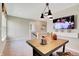 Upstairs loft area with a tv, work table, and neutral carpet at 1713 Hemlock Cir, Greenfield, IN 46140