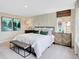 Neutral bedroom featuring large windows, modern furniture, and a padded bench at 1713 Hemlock Cir, Greenfield, IN 46140