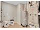 Functional utility room featuring a water heater, modern washer/dryer hookups, and ample space at 1713 Hemlock Cir, Greenfield, IN 46140