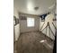 Neutral bedroom with carpet, window, and sports decor at 1716 Arlene Dr, Indianapolis, IN 46219