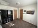 Bedroom featuring carpet, closet doors, sports wall art and a bookcase at 1716 Arlene Dr, Indianapolis, IN 46219