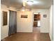 Bright living area with ceiling fan and view to the kitchen featuring natural light at 1716 Arlene Dr, Indianapolis, IN 46219