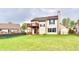 Spacious backyard with green lawn and two-story home with walkout deck, great for outdoor living at 181 Tracy Ridge Blvd, Whiteland, IN 46184