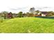 Expansive backyard with a partial fence and serene water view at 181 Tracy Ridge Blvd, Whiteland, IN 46184