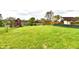 Expansive backyard with a partial fence and serene water view at 181 Tracy Ridge Blvd, Whiteland, IN 46184