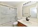 Bright bathroom featuring a tub-shower combo with sliding glass doors and a modern vanity at 181 Tracy Ridge Blvd, Whiteland, IN 46184