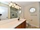 Modern bathroom with marble tiled shower, vanity with solid surface counter and stylish lighting at 181 Tracy Ridge Blvd, Whiteland, IN 46184