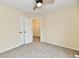 Comfortable carpeted bedroom featuring a ceiling fan and closet at 181 Tracy Ridge Blvd, Whiteland, IN 46184