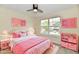 Bright bedroom features a ceiling fan, a large window and pink decor at 181 Tracy Ridge Blvd, Whiteland, IN 46184