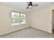 Bright bedroom with large window offering a pleasant view of the neighborhood at 181 Tracy Ridge Blvd, Whiteland, IN 46184