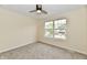 Bedroom featuring a ceiling fan, carpet, and a window overlooking the neighborhood at 181 Tracy Ridge Blvd, Whiteland, IN 46184