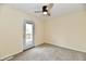 Cozy bedroom featuring neutral carpet, ceiling fan, and access to a patio at 181 Tracy Ridge Blvd, Whiteland, IN 46184