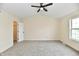 Spacious bedroom with ceiling fan, neutral walls and carpet, and a closet at 181 Tracy Ridge Blvd, Whiteland, IN 46184