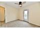 Clean and well-lit bedroom with a ceiling fan and an exit to a patio at 181 Tracy Ridge Blvd, Whiteland, IN 46184