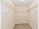 Walk-in closet with carpet and wire shelving for organized storage in a neutral color palette at 181 Tracy Ridge Blvd, Whiteland, IN 46184