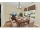 Elegant dining room with a rectangular table, chandelier, and bright window at 181 Tracy Ridge Blvd, Whiteland, IN 46184