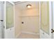 Functional laundry room with tile floor, white cabinets, and designated hookups at 181 Tracy Ridge Blvd, Whiteland, IN 46184