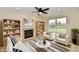 Well-lit living room showcasing a fireplace, bookshelves, and comfortable seating arrangement at 181 Tracy Ridge Blvd, Whiteland, IN 46184