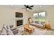 Living room with fireplace, sofa, armchairs, coffee table, rug, and natural light at 181 Tracy Ridge Blvd, Whiteland, IN 46184