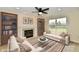 Cozy living room with a fireplace, built-in bookshelves, and comfortable couches at 181 Tracy Ridge Blvd, Whiteland, IN 46184